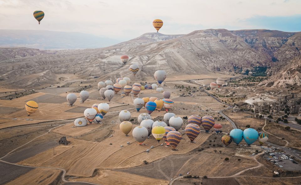 Hot air balloons in Goreme red valley - Pasabag Open Air Museum: seeing fairy chimneys up close after the sky