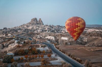 Hot air balloons in Goreme red valley - Hotel pickup and the small-group advantage (English guide included)