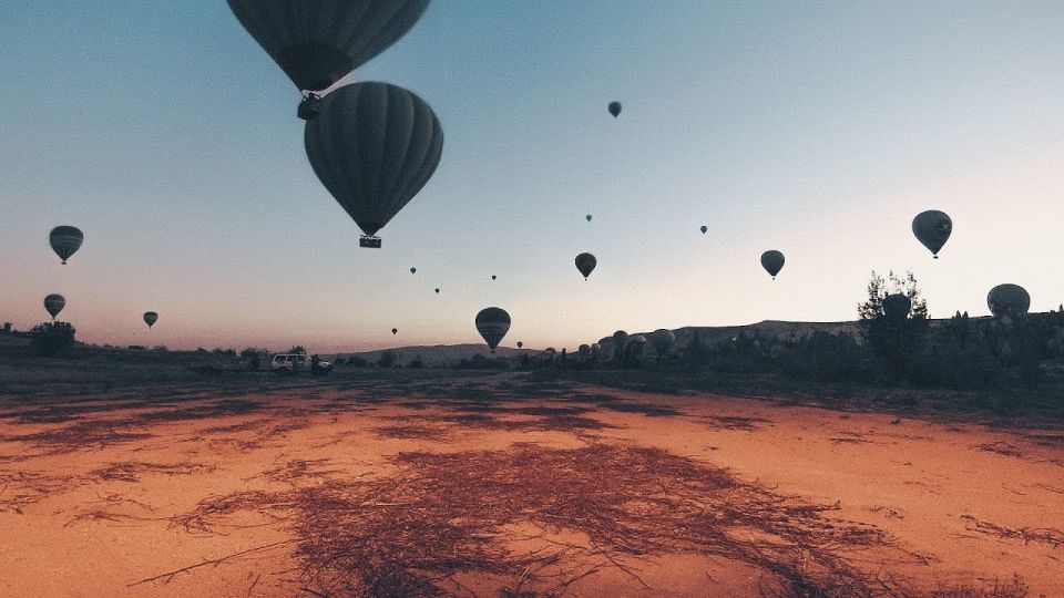 Hot air balloons in Goreme red valley - Kızılçukur: the red valley angle from street level